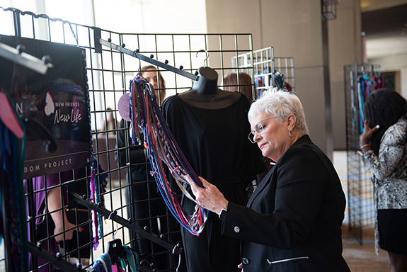 Carolyn Miller shops for a scarf in the Abi Ferrin Pop-Up Shop