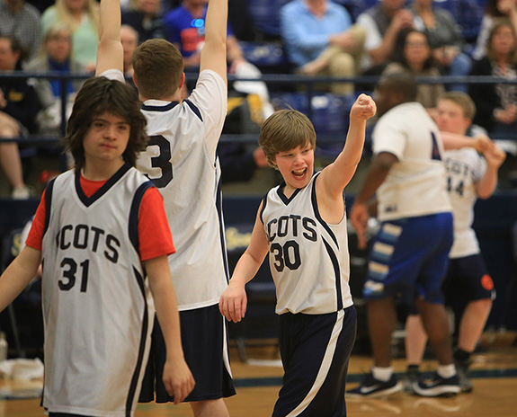 Miles Gill of the Highland Park white team points to the crowd after a crucial play.