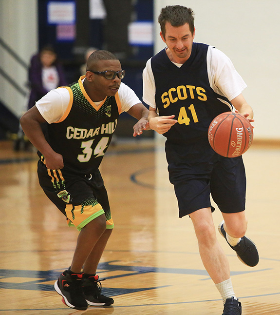 James Nix (41) of the Highland Park Blue Team drives the lane during the blue team's game